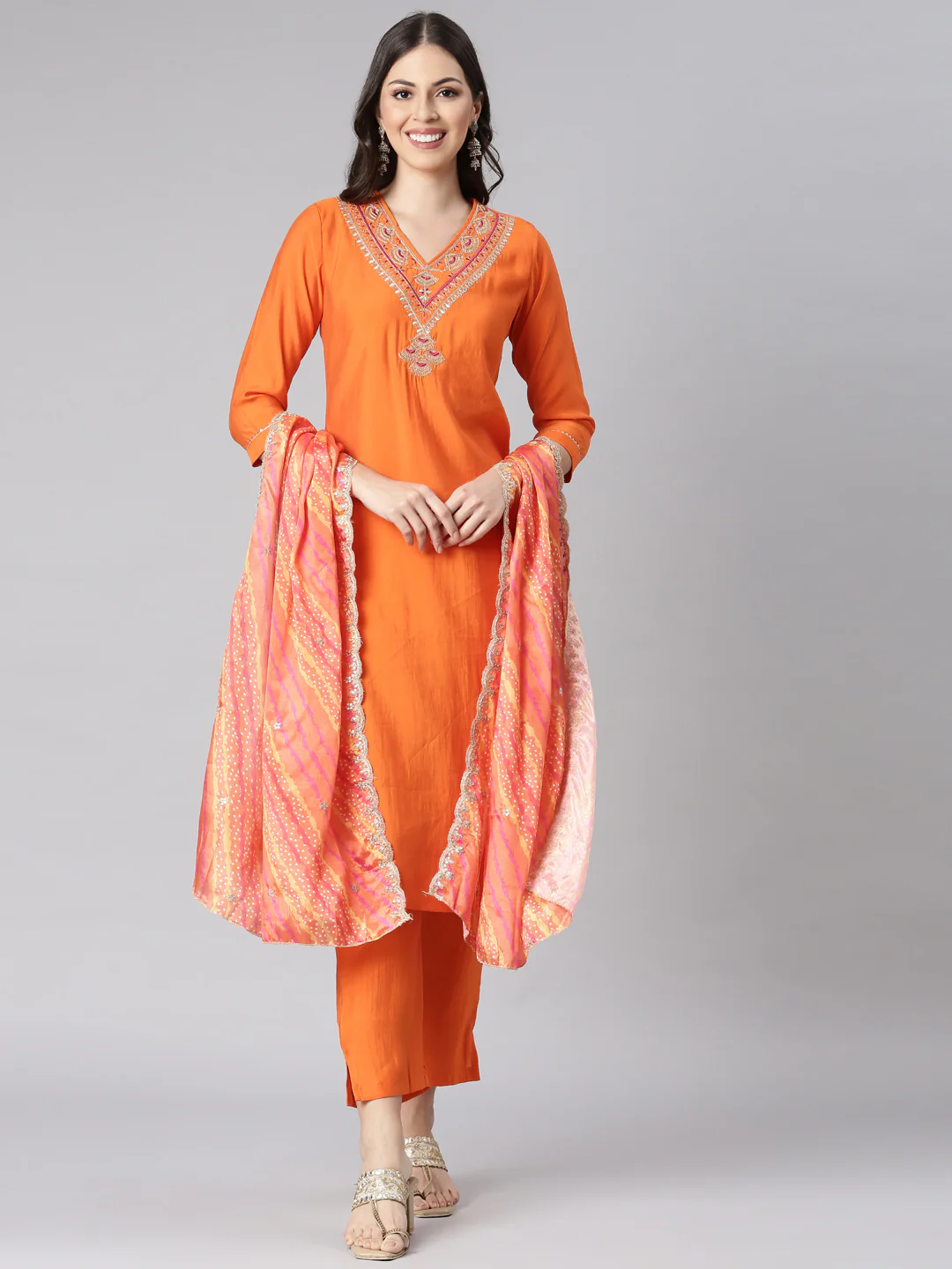 Neerus Orange Solid Straight Kurta and Trousers With Dupatta